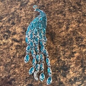 Elegant Silver and Blue Peacock Brooch